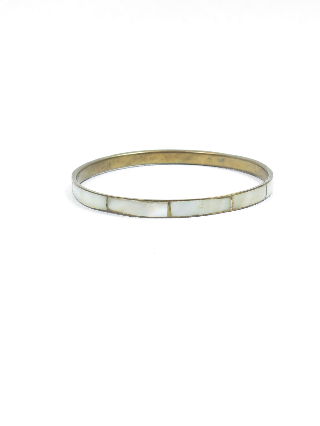 Gold coloured vintage bangle with a white stone 